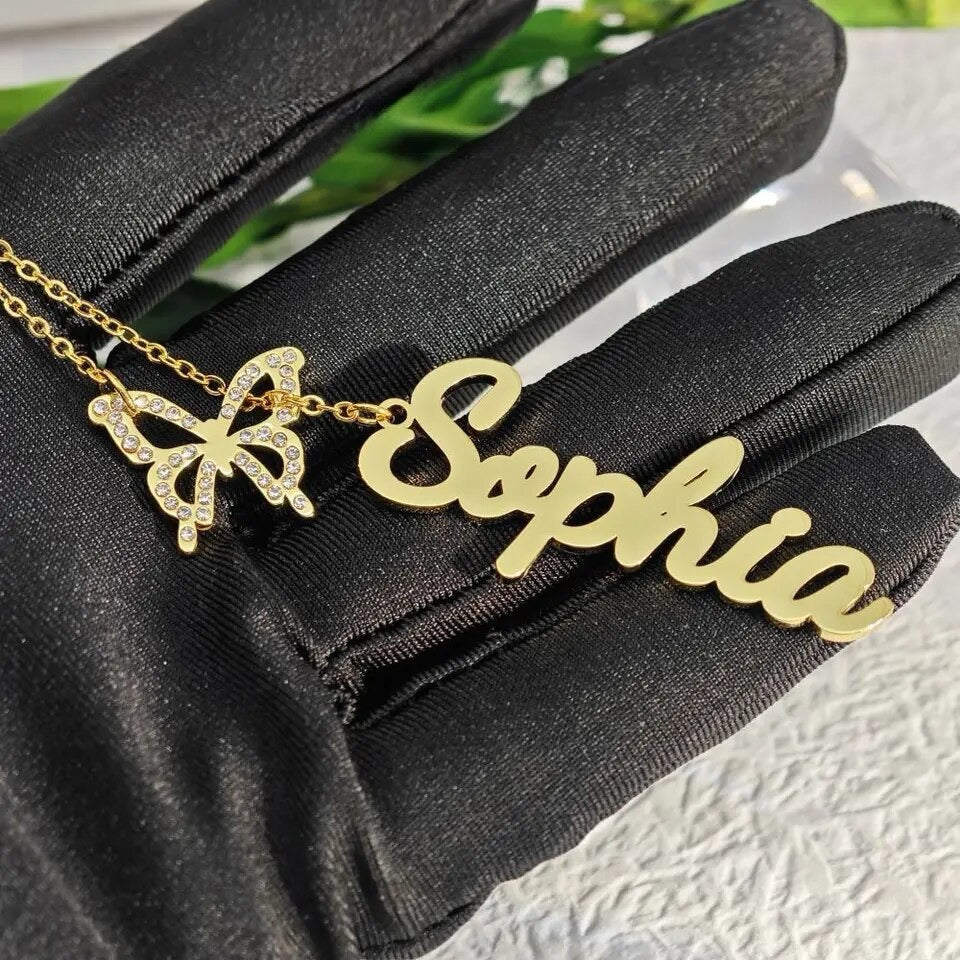 Custom name butterfly charm necklace with a delicate, personalized design, Queendom Treasurez.