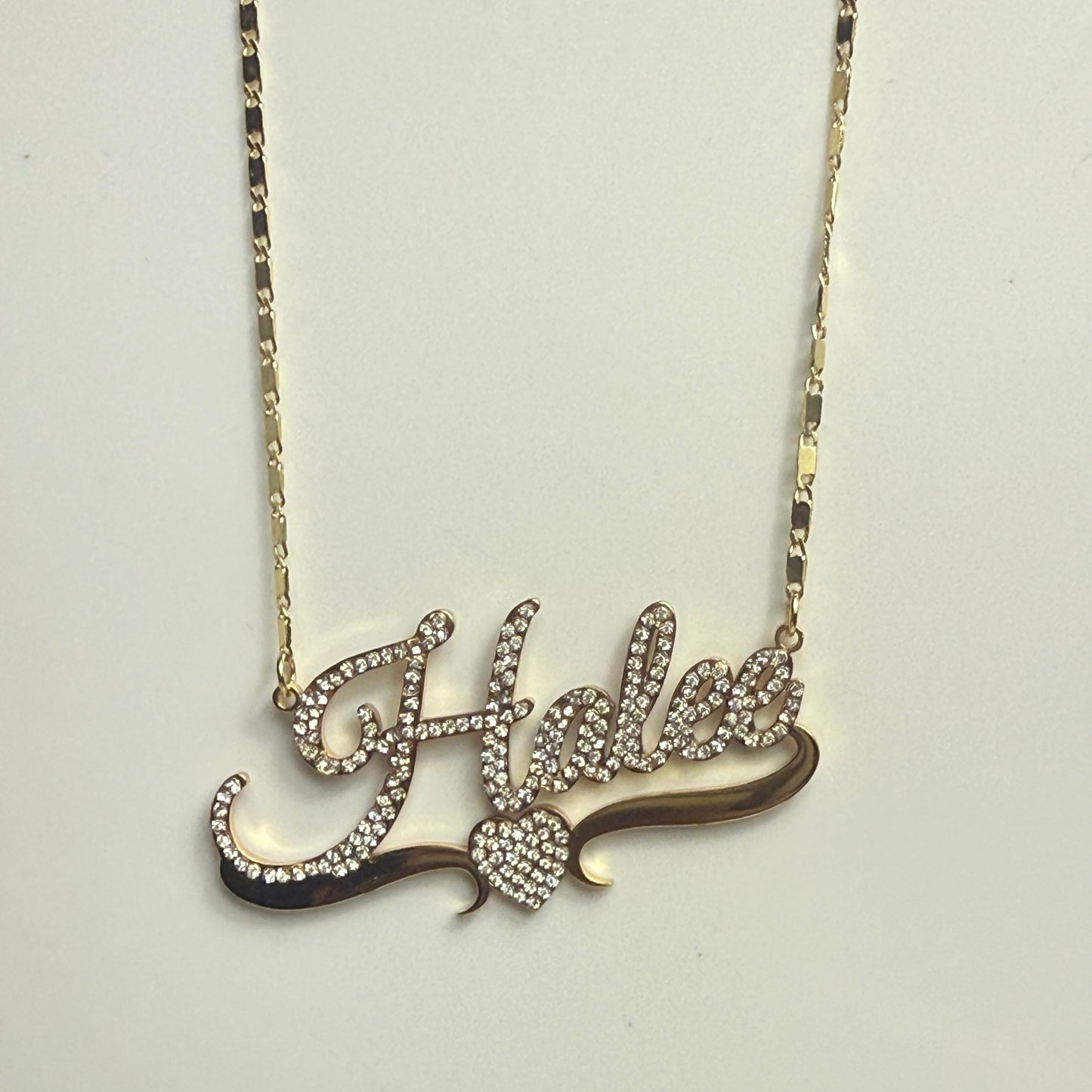 Decorative hairpin with intricate design on a light gray background