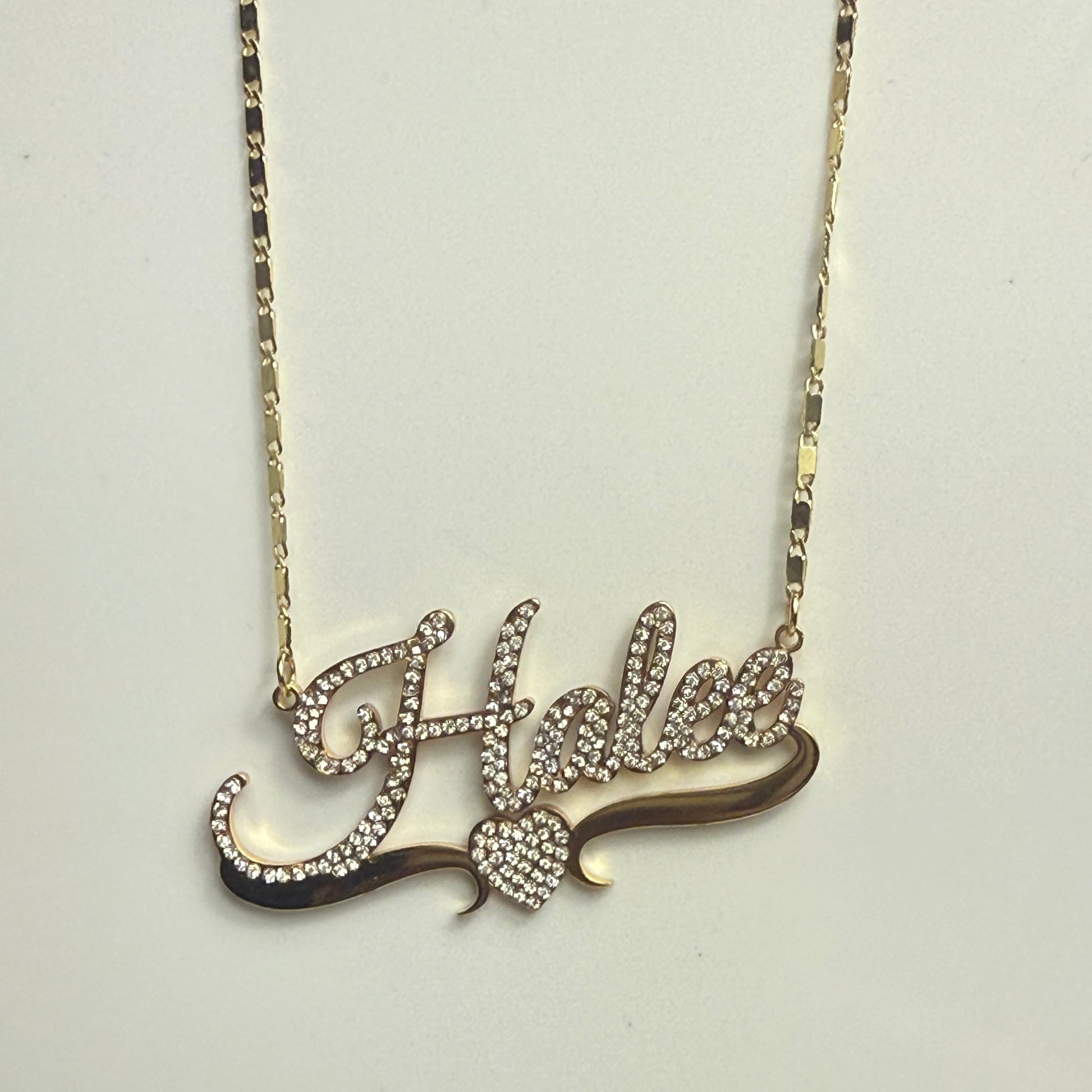 Decorative hairpin with intricate design on a light gray background