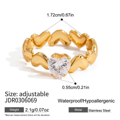 Gold ring with a clear gemstone, showing measurements and product details on a white background.