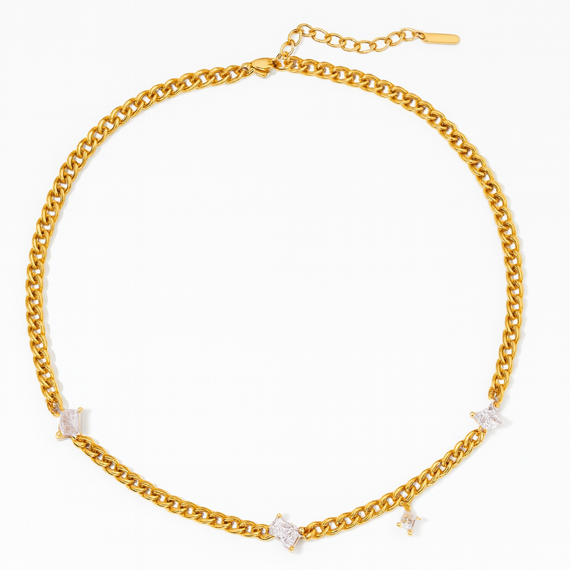 Gold chain necklace with small diamonds on a white background