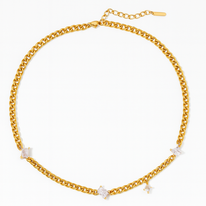 Gold chain necklace with small diamonds on a white background