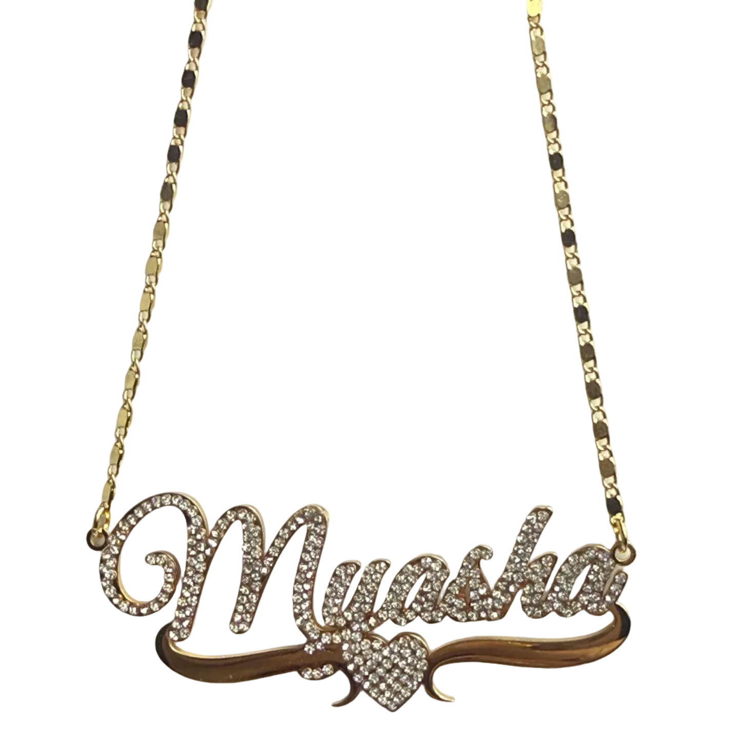 Gold necklace with a leaf-shaped pendant on a light gray background