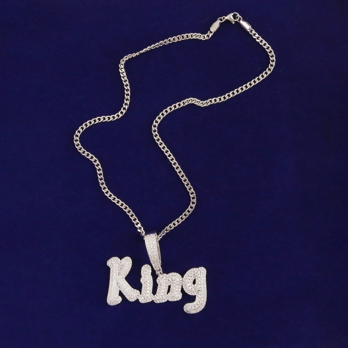 Iced-out custom bubble cursive name necklace with personalized engraving and sparkling stones – Queendom Treasurez.